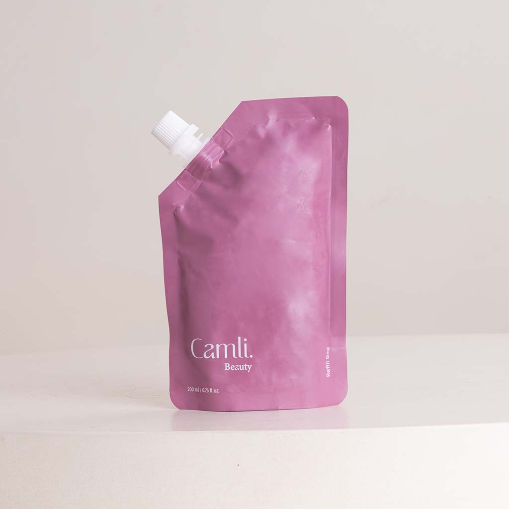 product-image-مجموعة هدايا العناية بالجسم من كاملي نايرا مع مزهرية من الورود البنفسجية
