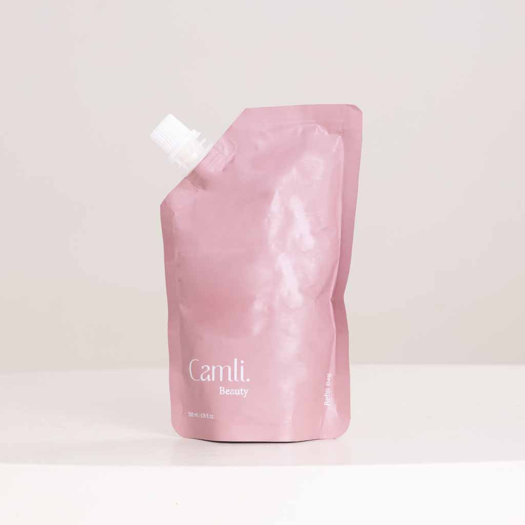 product-image-مجموعة هدايا العناية بالجسم من كاملي نايرا مع مزهرية من الورود البنفسجية