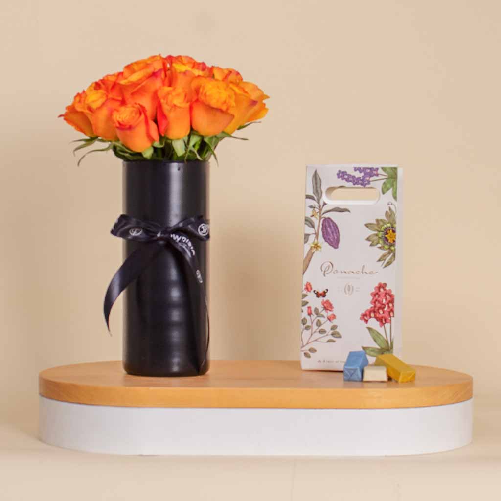 Flowrista Online Flowers Shop Panache Chocolate Box with Black Vase of 20 Orange Flowers